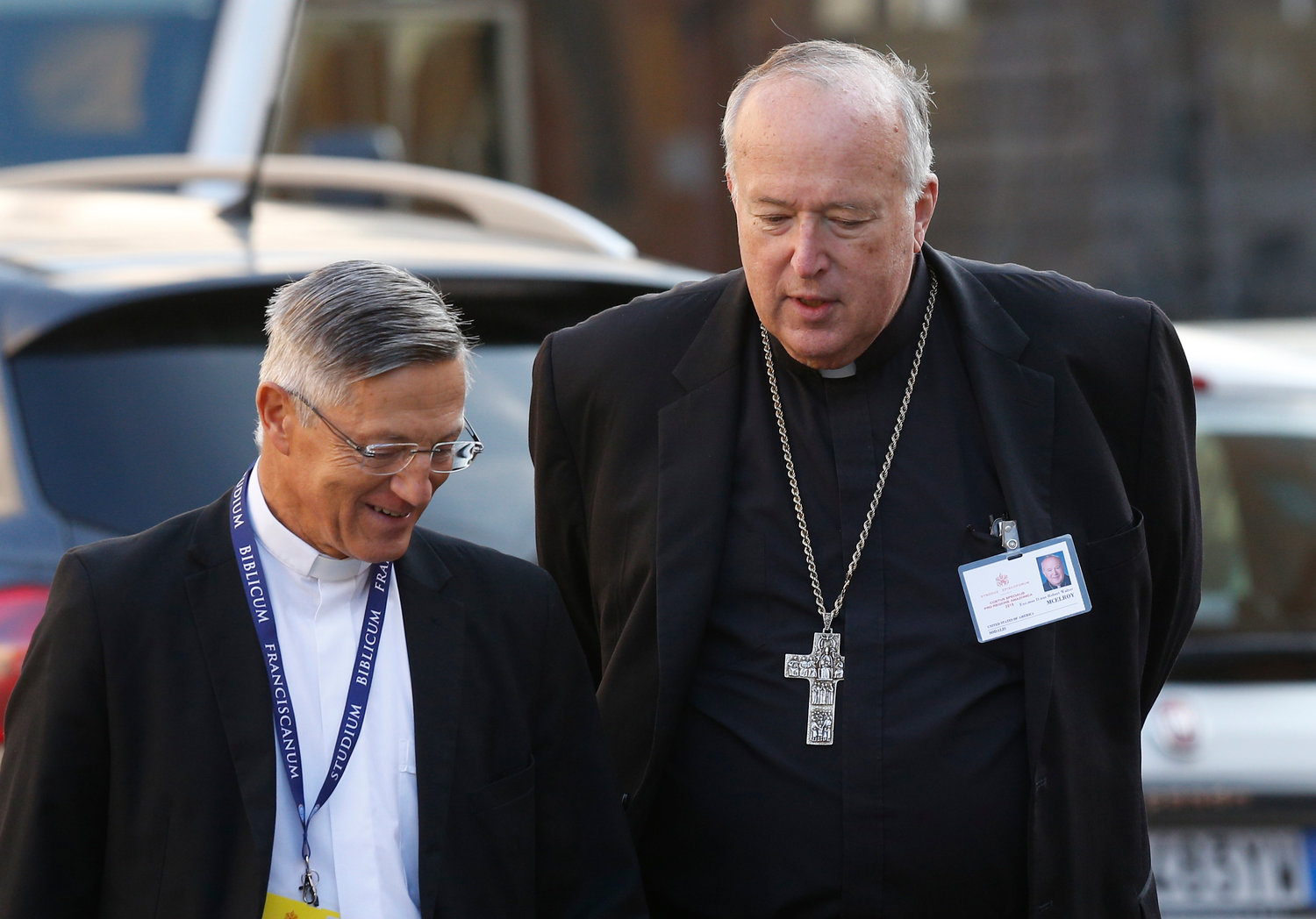 Bishop Robert W. McElroy of San Diego talks with Father Bernardo Estrada as they arrive for a session of the Synod of Bishops for the Amazon at the Vatican Oct. 15, 2019.
